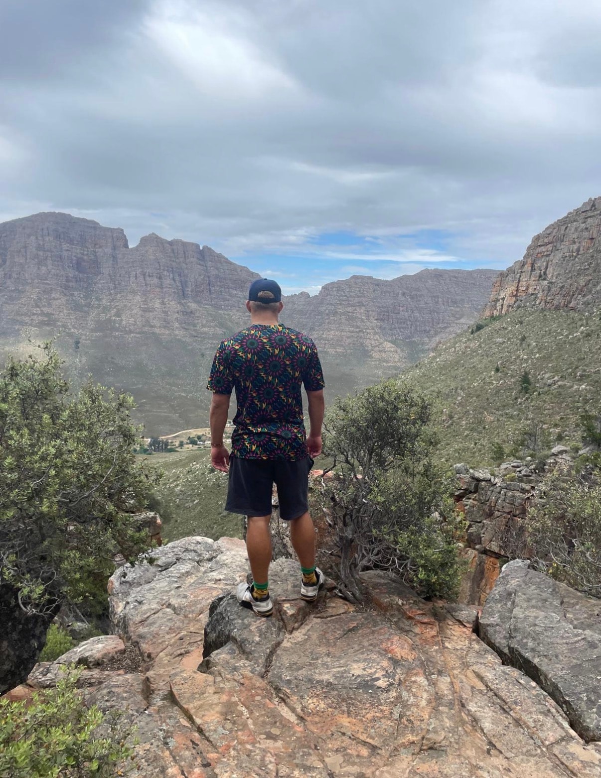 Person overlooking a mountain valley